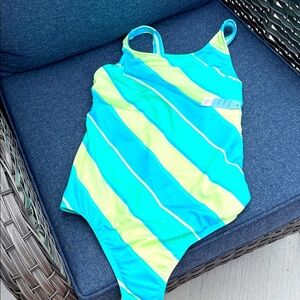 Women’s Striped One-Piece Swimsuit new- never worn with tag. Criss cross back.
